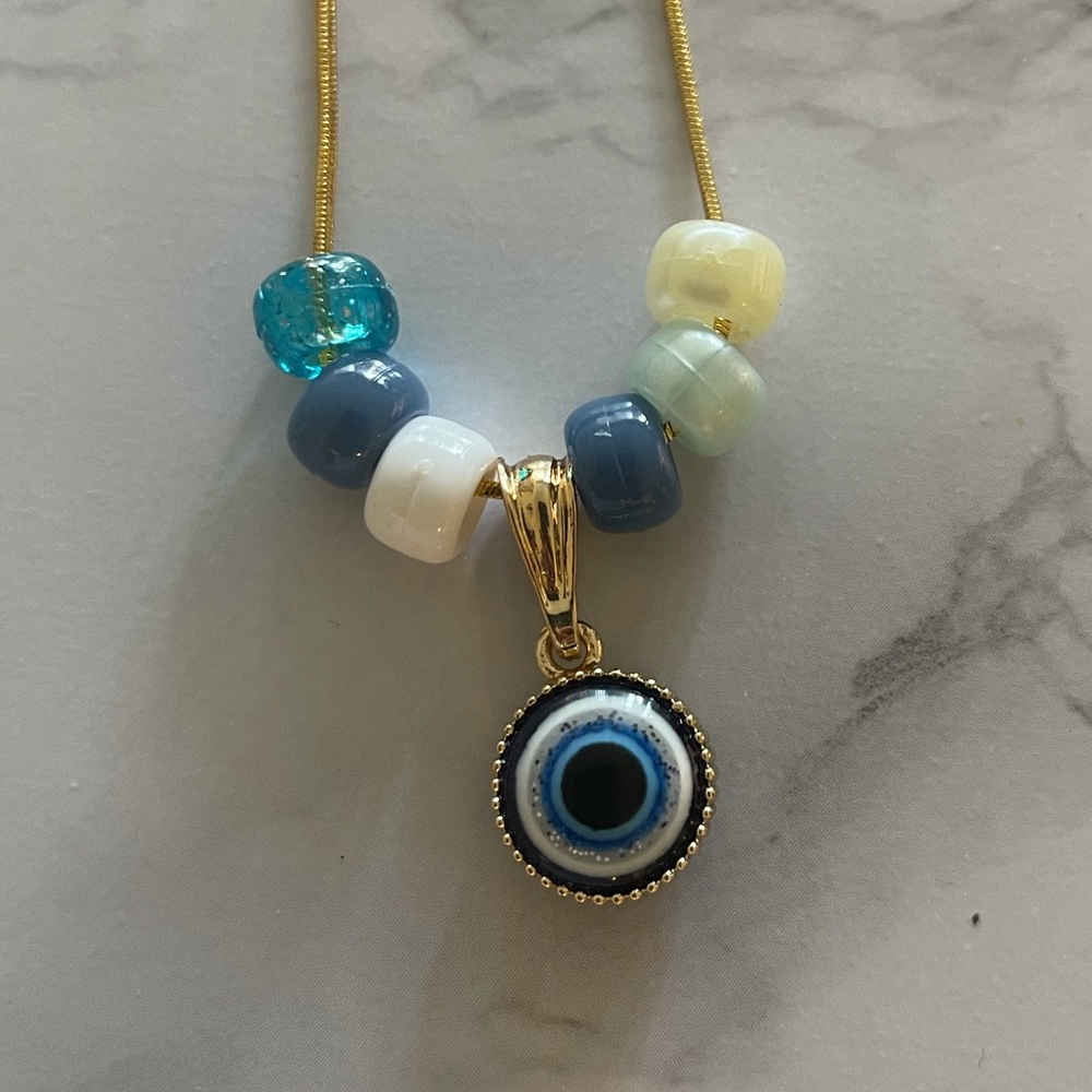 The evil eye necklace with beads, evil eye